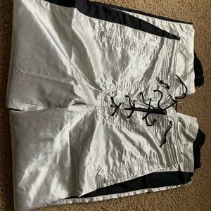 Unique shiny silver ski pants. Lace up front and drawstring waist.